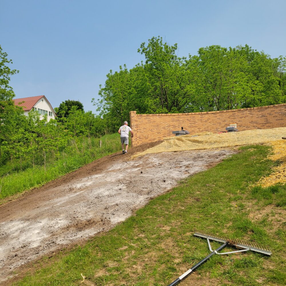 Landscapers working on adding grass