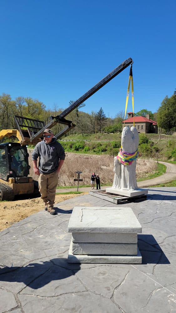 Angel statue placed onto memorial floor